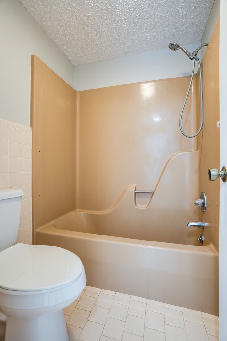 418 Spout Spring Road Dover, TN 37058 - Photo 20 of 36 a bathroom with a toilet and a shower