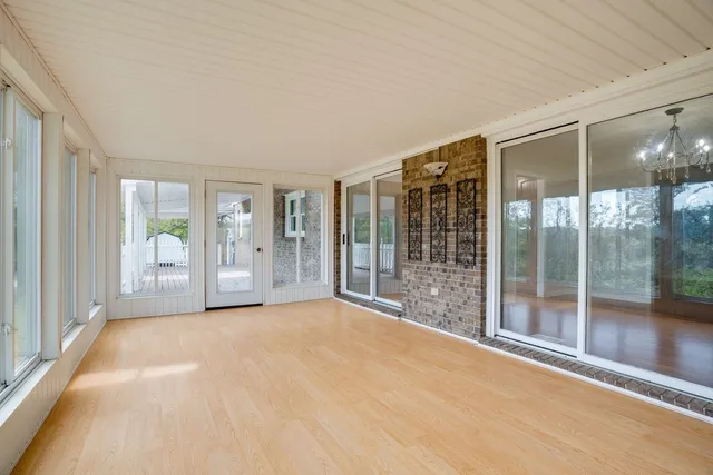 a view of porch with wooden floor