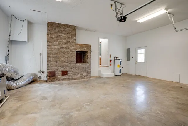 a view of backyard with wooden floor and floor to ceiling window