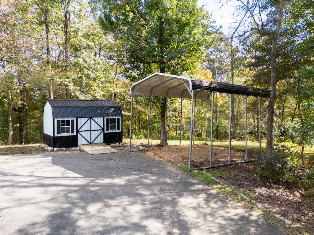 418 Spout Spring Road Dover, TN 37058 - Photo 30 of 36 a view of a house with backyard and sitting area