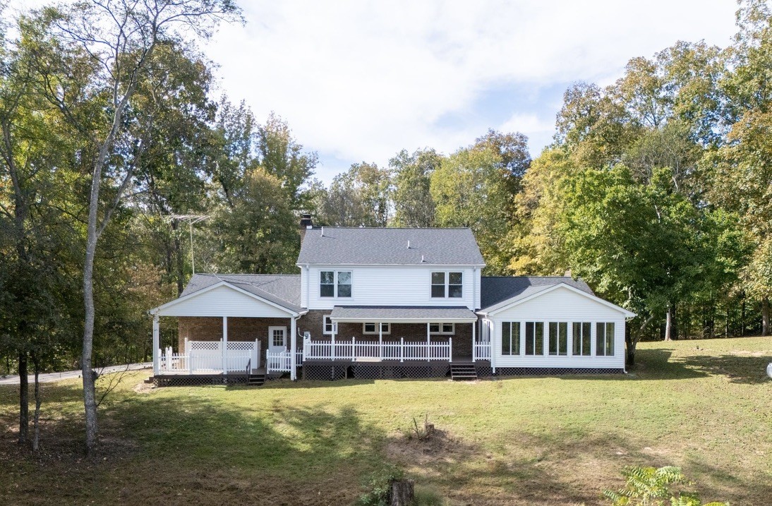418 Spout Spring Road Dover, TN 37058 - Photo 31 of 36 a front view of a house with yard and large trees