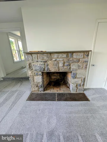 a view of fireplace and utility room in empty room