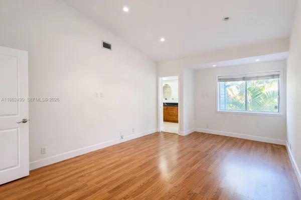 a area with granite countertop a white sink and vanity