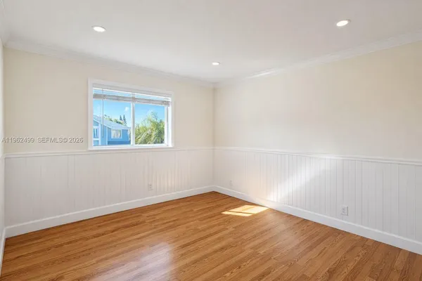 an empty room with wooden floor