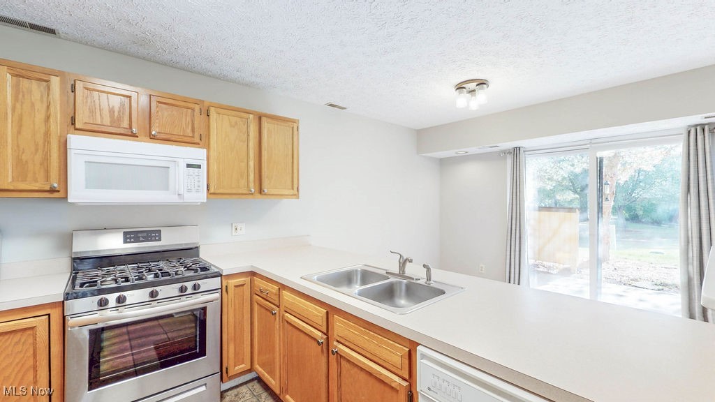 1426 Loop Road, Unit 1426 Kent, OH 44240 - Photo 40 of 40 Kitchen has nice floor plan open to the dining room and the sliding glass doors bring in so much natural light.