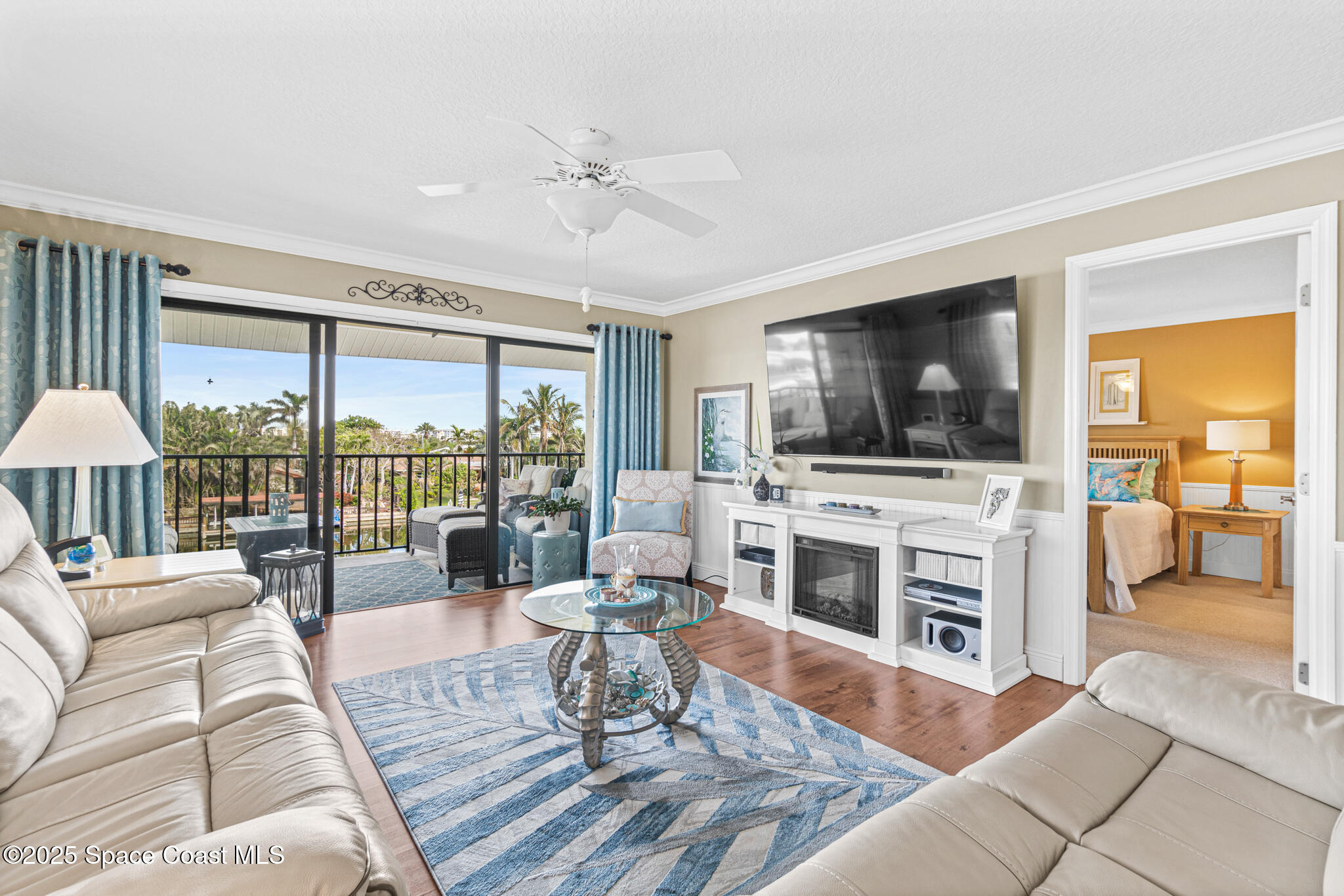 300 South Banana River Boulevard, Unit 301 Cocoa Beach, FL 32931 - Photo 8 of 44 Balcony Access in Living Room
