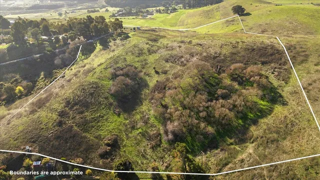 a view of an ocean from a mountain