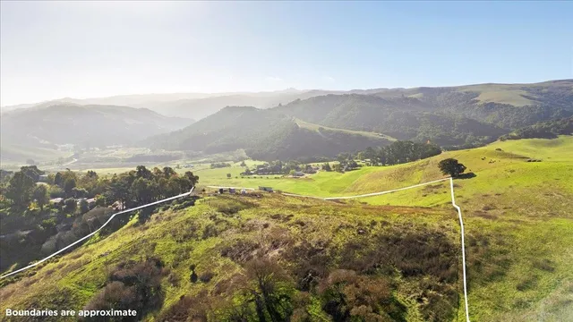 a view of an ocean and a mountain