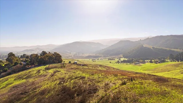 a view of an ocean and a mountain
