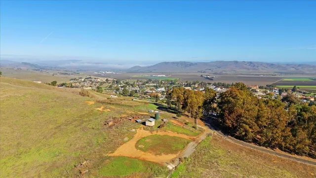 a view of a city and mountains in the background