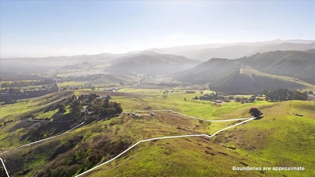 a view of an ocean and a mountain