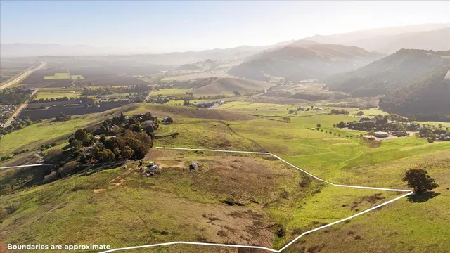 a view of an ocean from a mountain