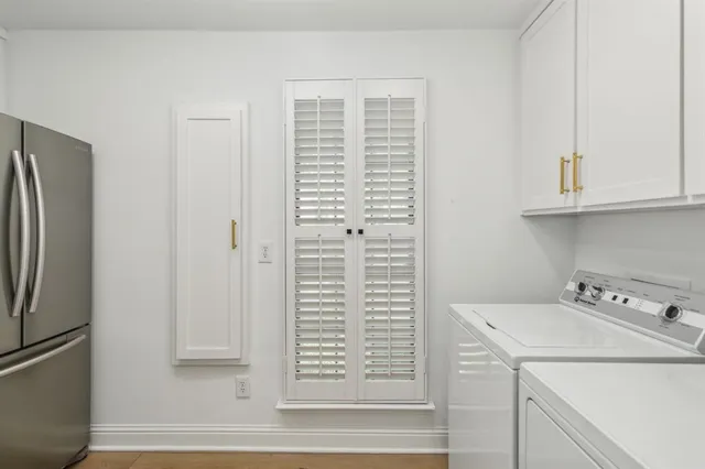 a view of bathroom with washer and dryer