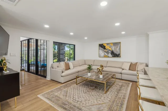 a living room with furniture or couch and a wooden floor