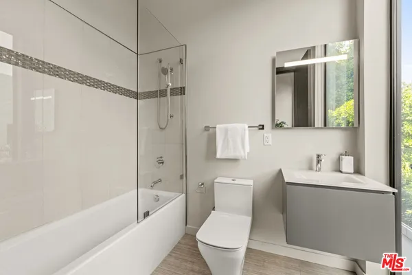 a bathroom with a toilet sink and bathtub