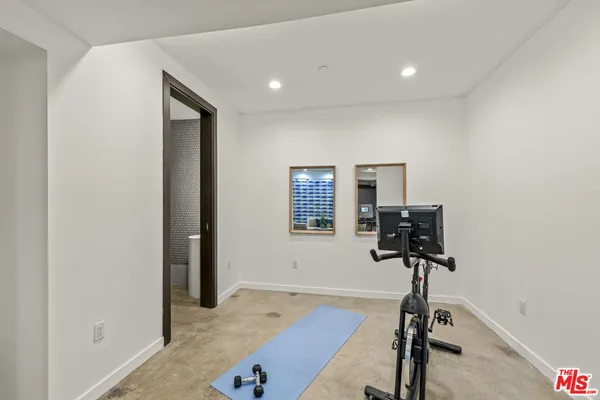 a bedroom with a bed and a lamp