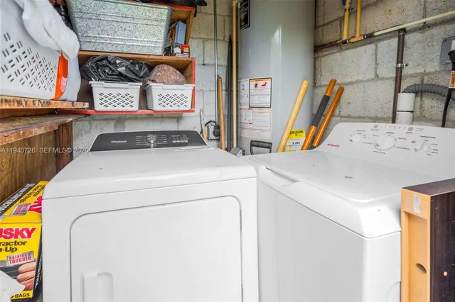 a utility room with dryer and washer