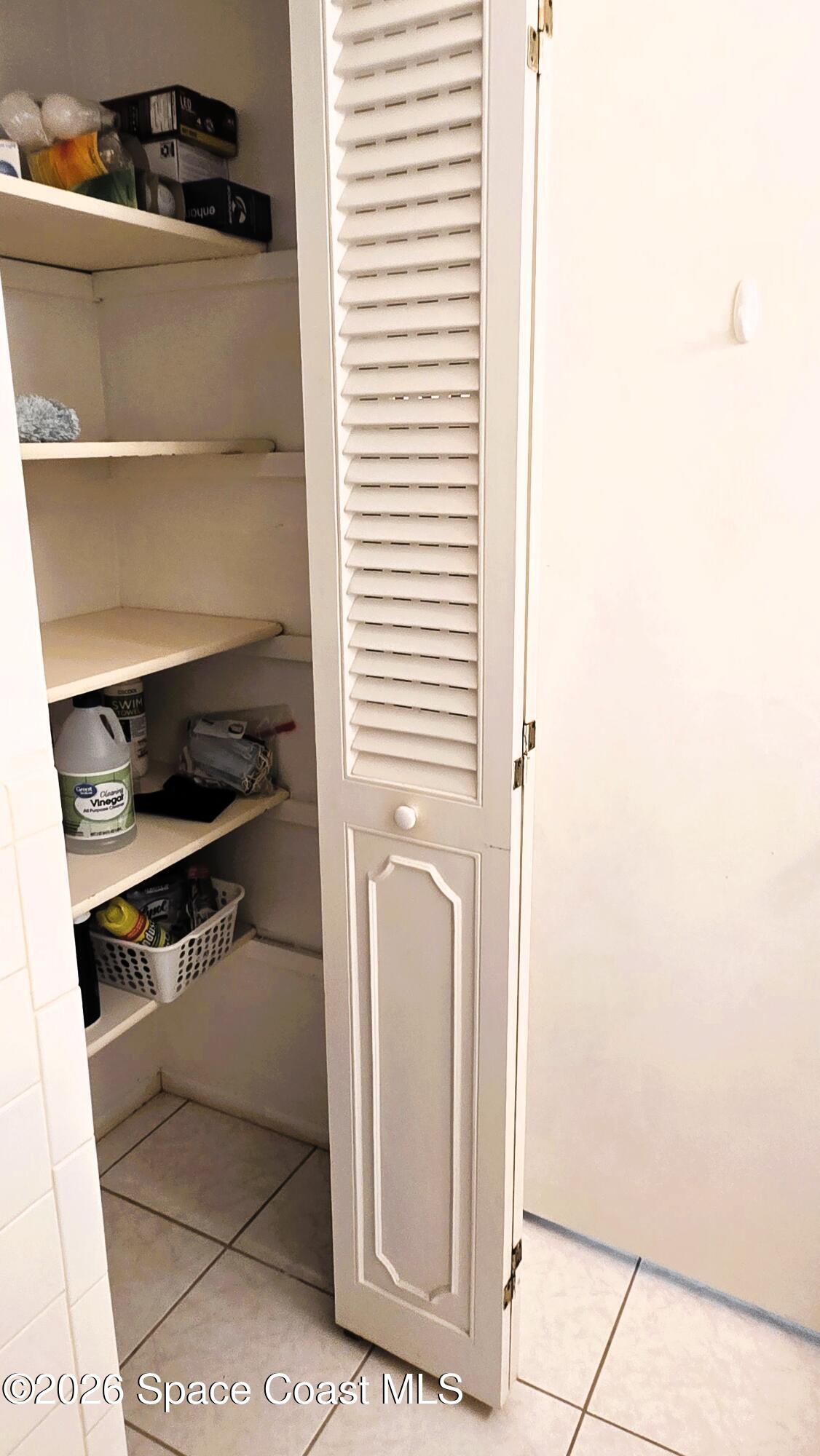 412 School Road, Unit 88 Indian Harbour Beach, FL 32937 - Photo 26 of 50 Main bath linen closet