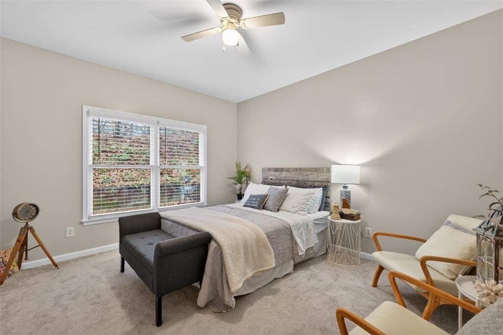 2641 Hillgrove Drive Dacula, GA 30019 - Photo 21 of 57 a bedroom with a bed and a window