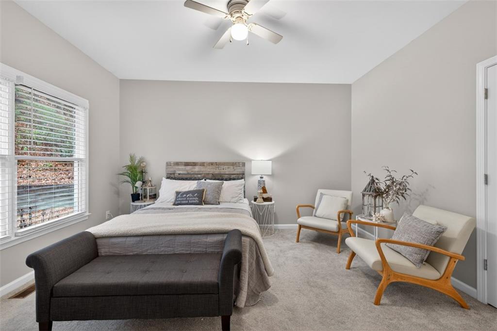 2641 Hillgrove Drive Dacula, GA 30019 - Photo 23 of 57 a bedroom with a bed chair and window