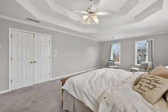 a bathroom with a sink a toilet and shower curtain