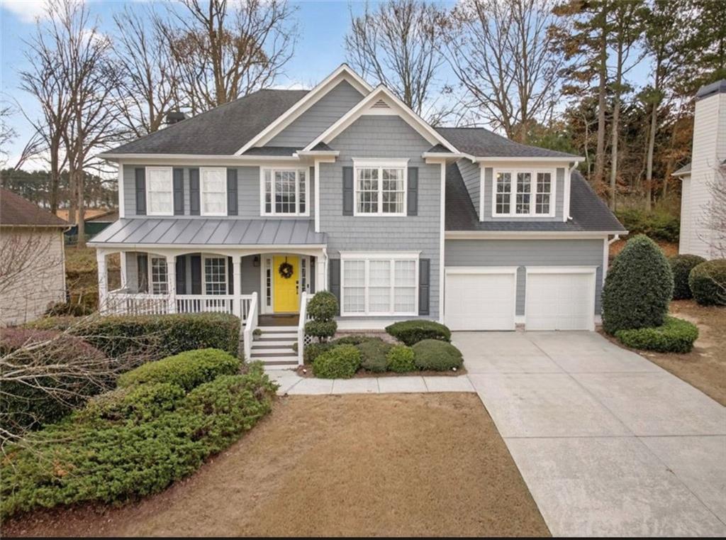 2641 Hillgrove Drive Dacula, GA 30019 - Photo 3 of 57 a front view of a house with a yard and garage