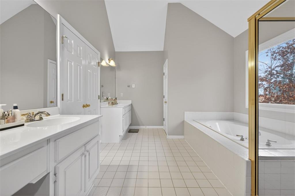 2641 Hillgrove Drive Dacula, GA 30019 - Photo 31 of 57 a bathroom with a sink a toilet a mirror and bathtub