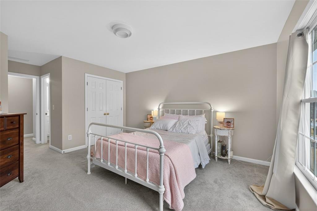 2641 Hillgrove Drive Dacula, GA 30019 - Photo 35 of 57 a bedroom with a bed and a cabinets