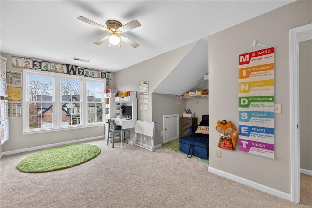 2641 Hillgrove Drive Dacula, GA 30019 - Photo 38 of 57 a living room with furniture and a window