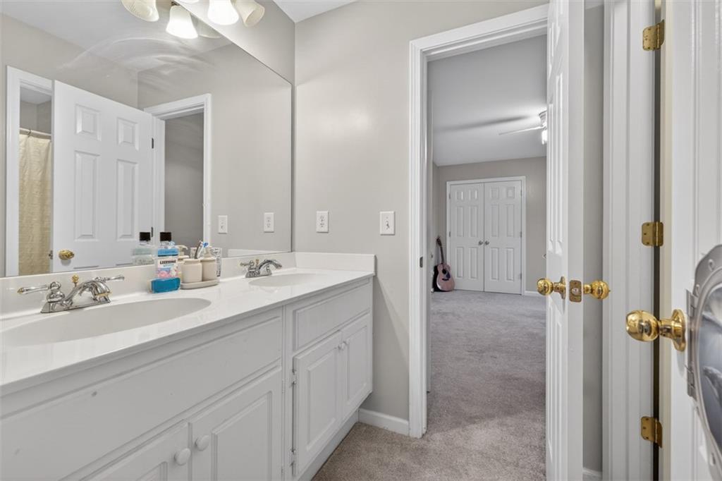 2641 Hillgrove Drive Dacula, GA 30019 - Photo 41 of 57 a bathroom with a double vanity sink mirror and