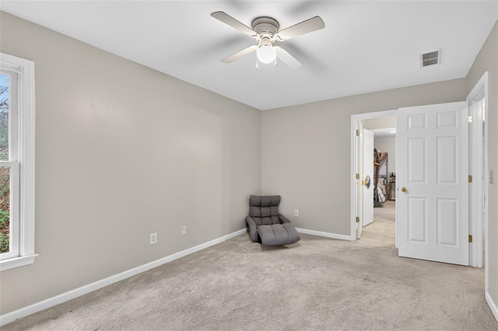 2641 Hillgrove Drive Dacula, GA 30019 - Photo 43 of 57 a view of empty room with a ceiling fan