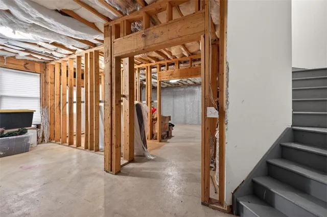 a view of a swimming pool with a patio and a yard