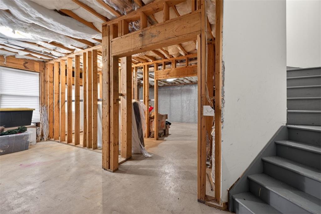2641 Hillgrove Drive Dacula, GA 30019 - Photo 46 of 57 a view of a hallway with wooden floor and staircase