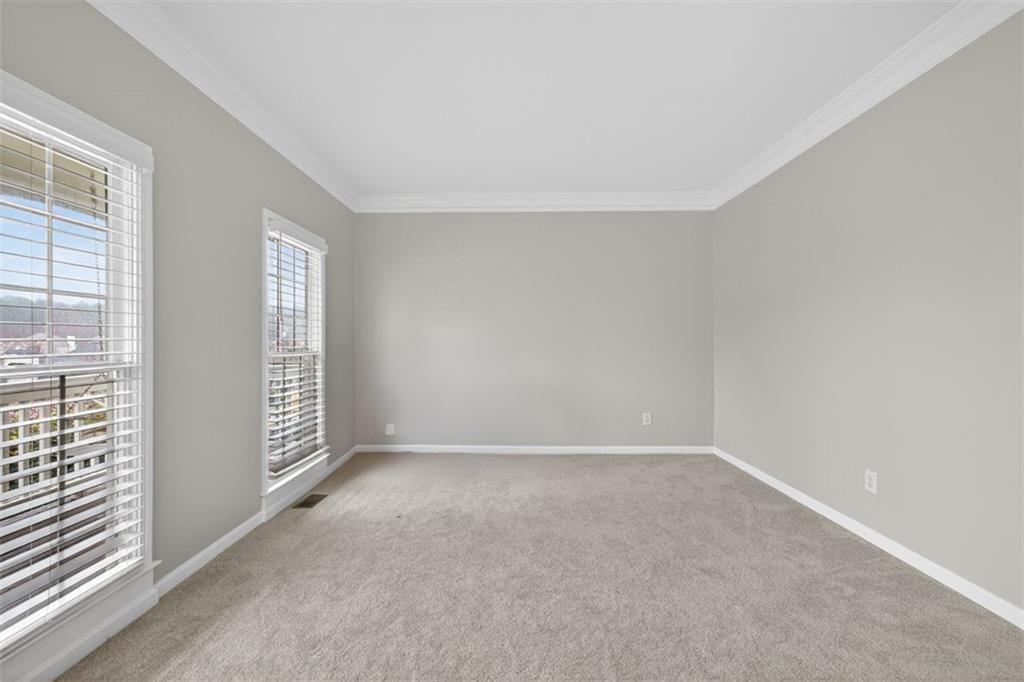 2641 Hillgrove Drive Dacula, GA 30019 - Photo 5 of 57 an empty room with windows