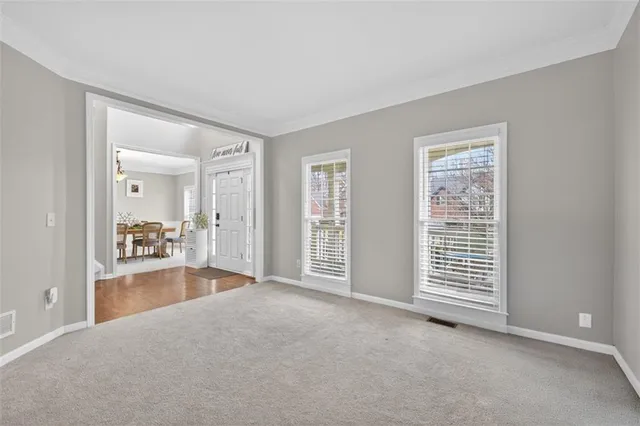 a view of a dining room with furniture window and outside view