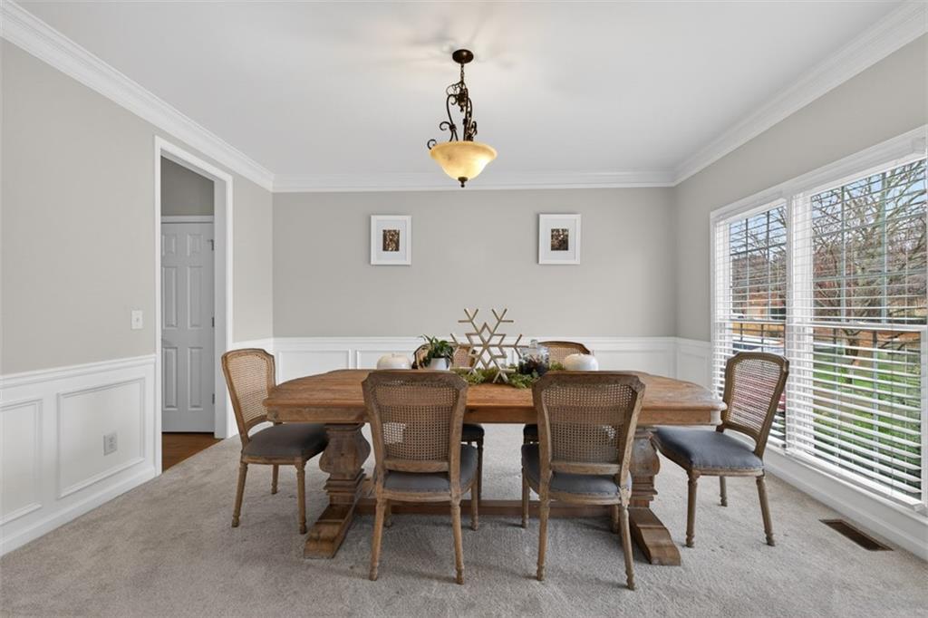 2641 Hillgrove Drive Dacula, GA 30019 - Photo 9 of 57 a view of a dining room with furniture and a window