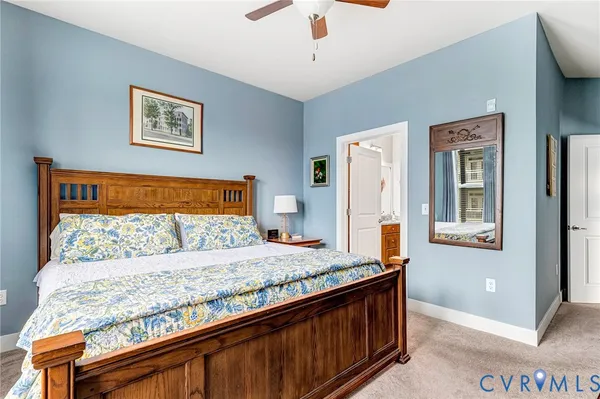 a utility room with cabinets and wooden floor