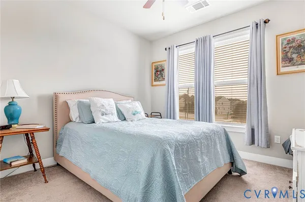 a view of a dining room with furniture and a kitchen