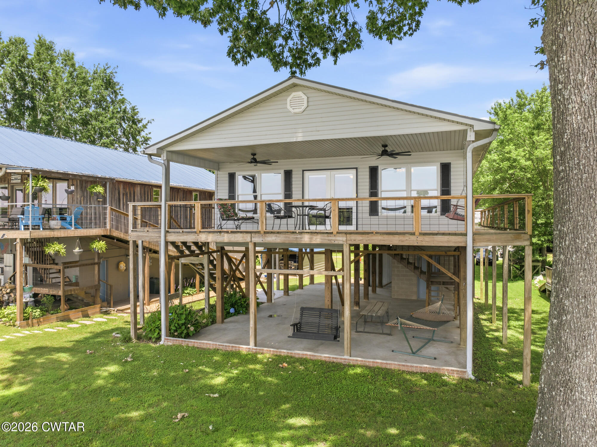 1728 Yarbro Landing Lane Decaturville, TN 38329 - Photo 1 of 44 a view of a house with a yard porch and sitting area