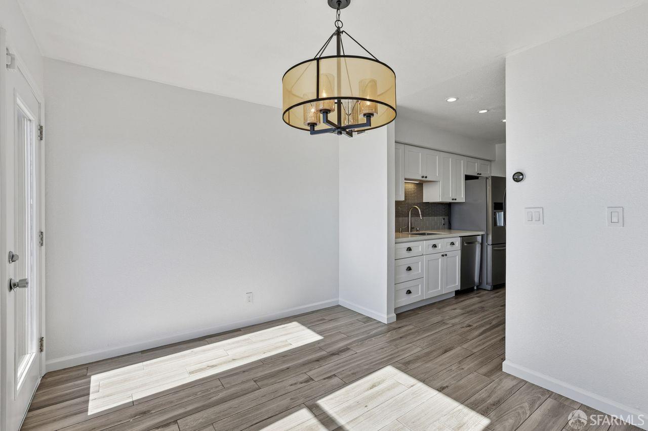 59 Kiska Road San Francisco, CA 94124 - Photo 15 of 46 a view of a kitchen with wooden floor and a window