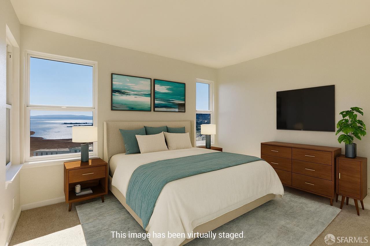 59 Kiska Road San Francisco, CA 94124 - Photo 17 of 46 a bedroom with a bed and a flat tv screen on dresser