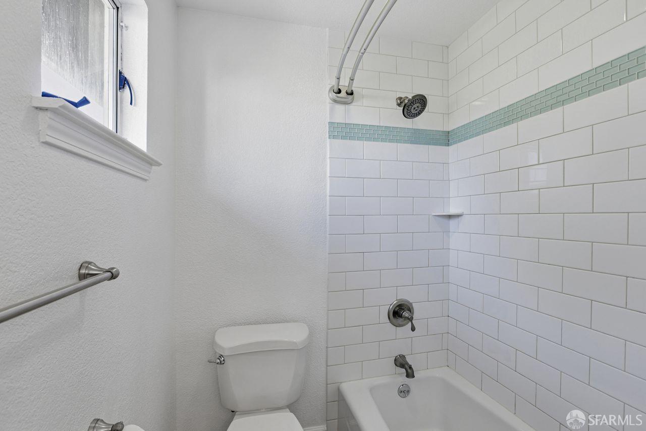 59 Kiska Road San Francisco, CA 94124 - Photo 20 of 46 a bathroom with a sink a toilet and shower
