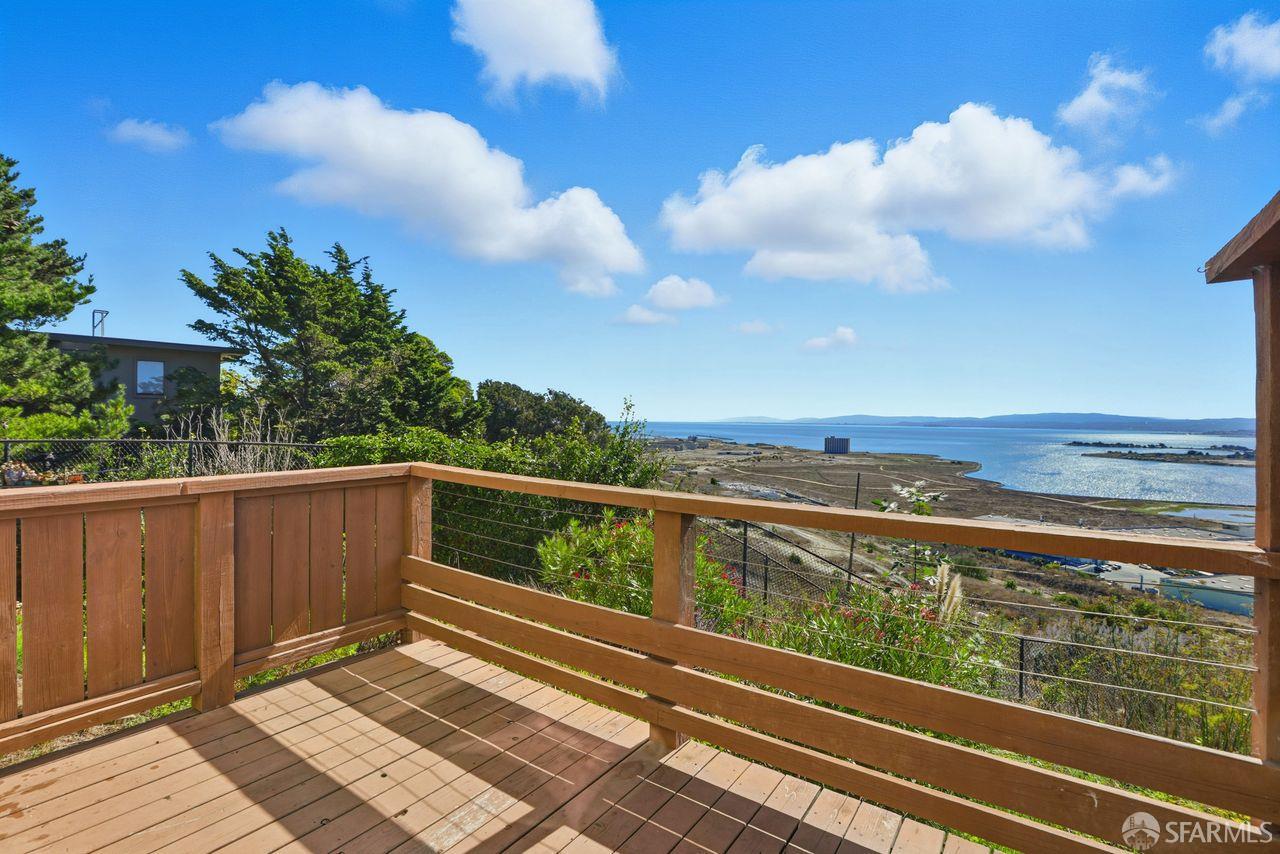 59 Kiska Road San Francisco, CA 94124 - Photo 2 of 46 a view of balcony with wooden floor and fence