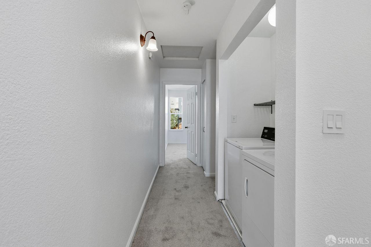 59 Kiska Road San Francisco, CA 94124 - Photo 33 of 46 a view of a hallway with a white cabinet and a mirror