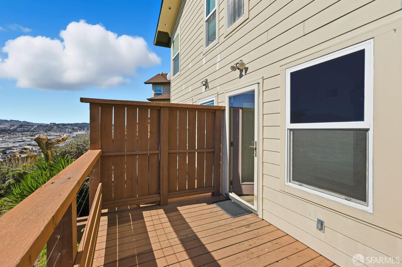 59 Kiska Road San Francisco, CA 94124 - Photo 38 of 46 a view of a balcony with wooden floor and fence