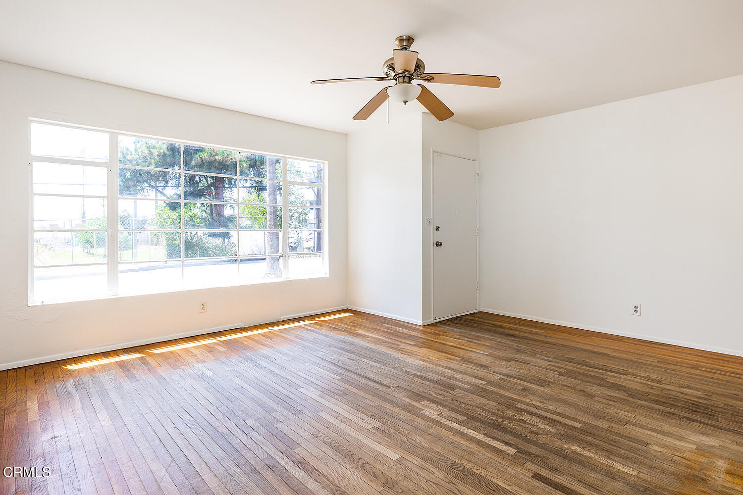 114 South Canyon Boulevard Monrovia, CA 91016 - Photo 16 of 32 a view of an empty room with wooden floor and a window