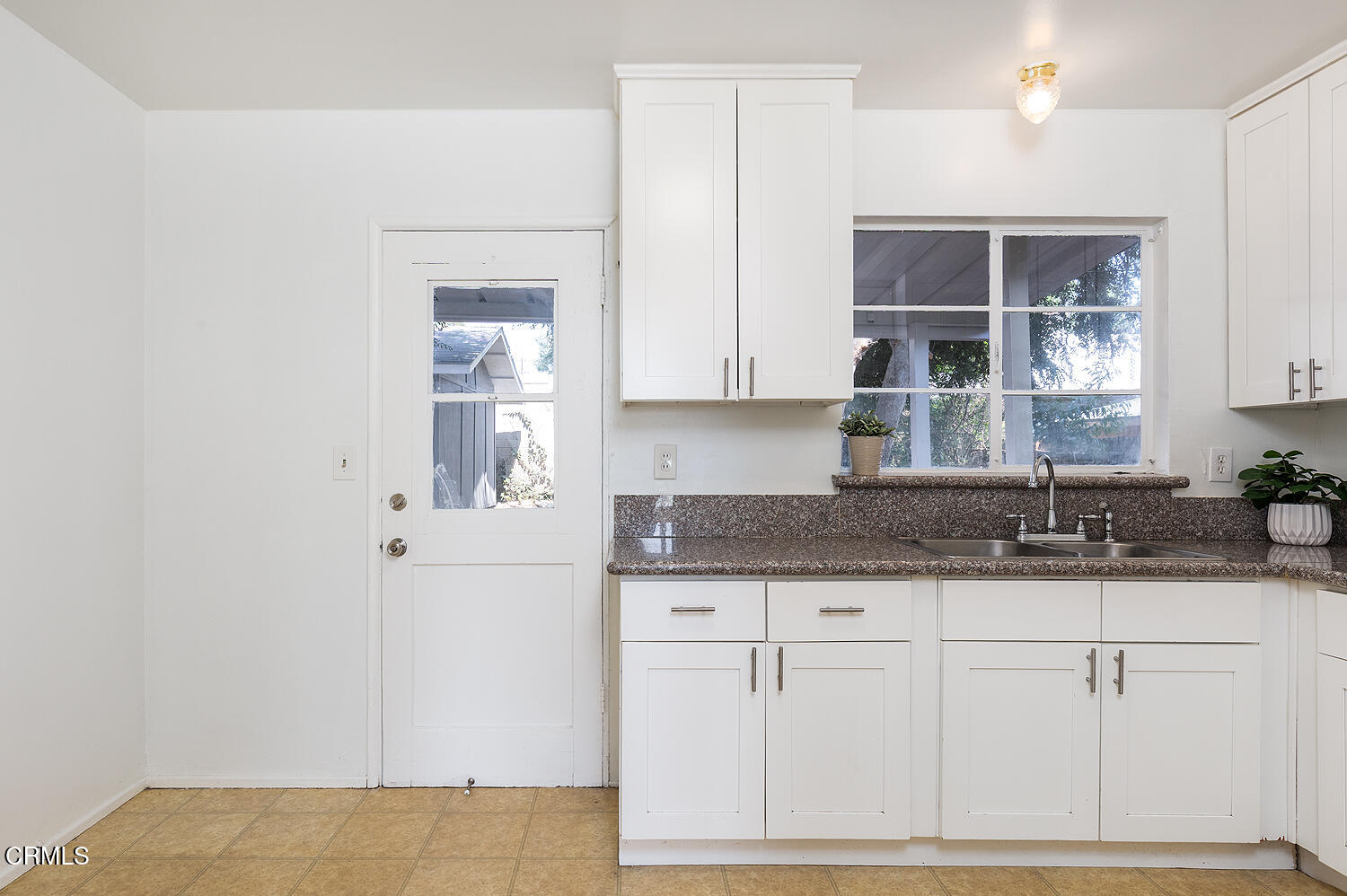 114 South Canyon Boulevard Monrovia, CA 91016 - Photo 19 of 32 a kitchen with granite countertop a sink and cabinets