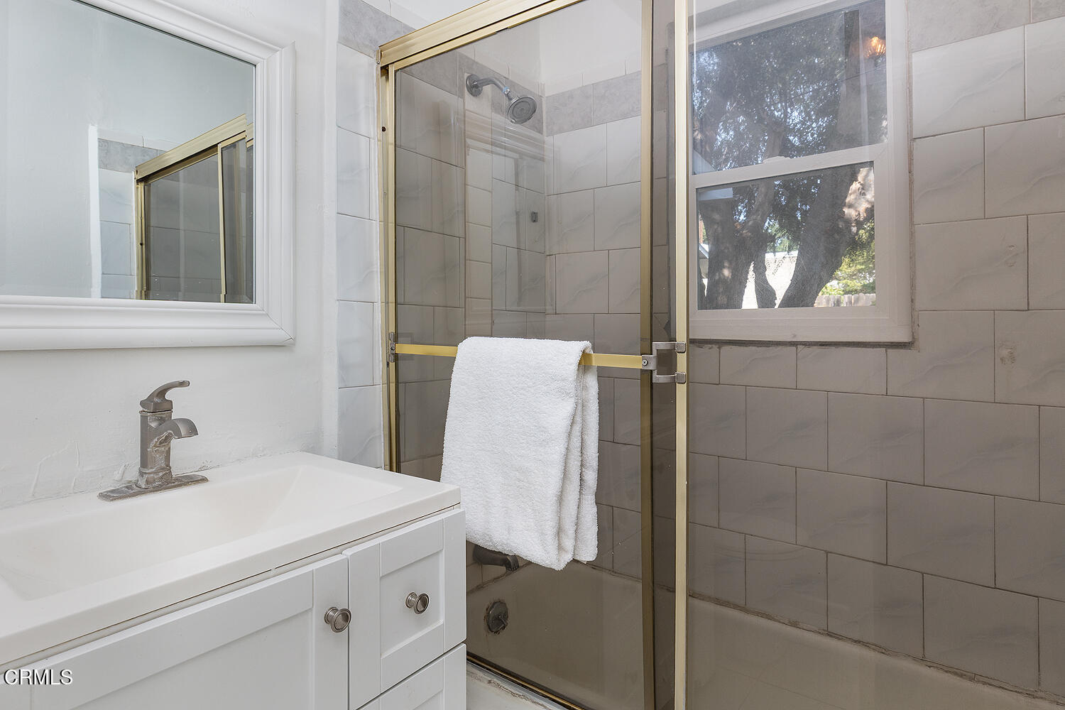 114 South Canyon Boulevard Monrovia, CA 91016 - Photo 24 of 32 a bathroom with a sink and mirror with window