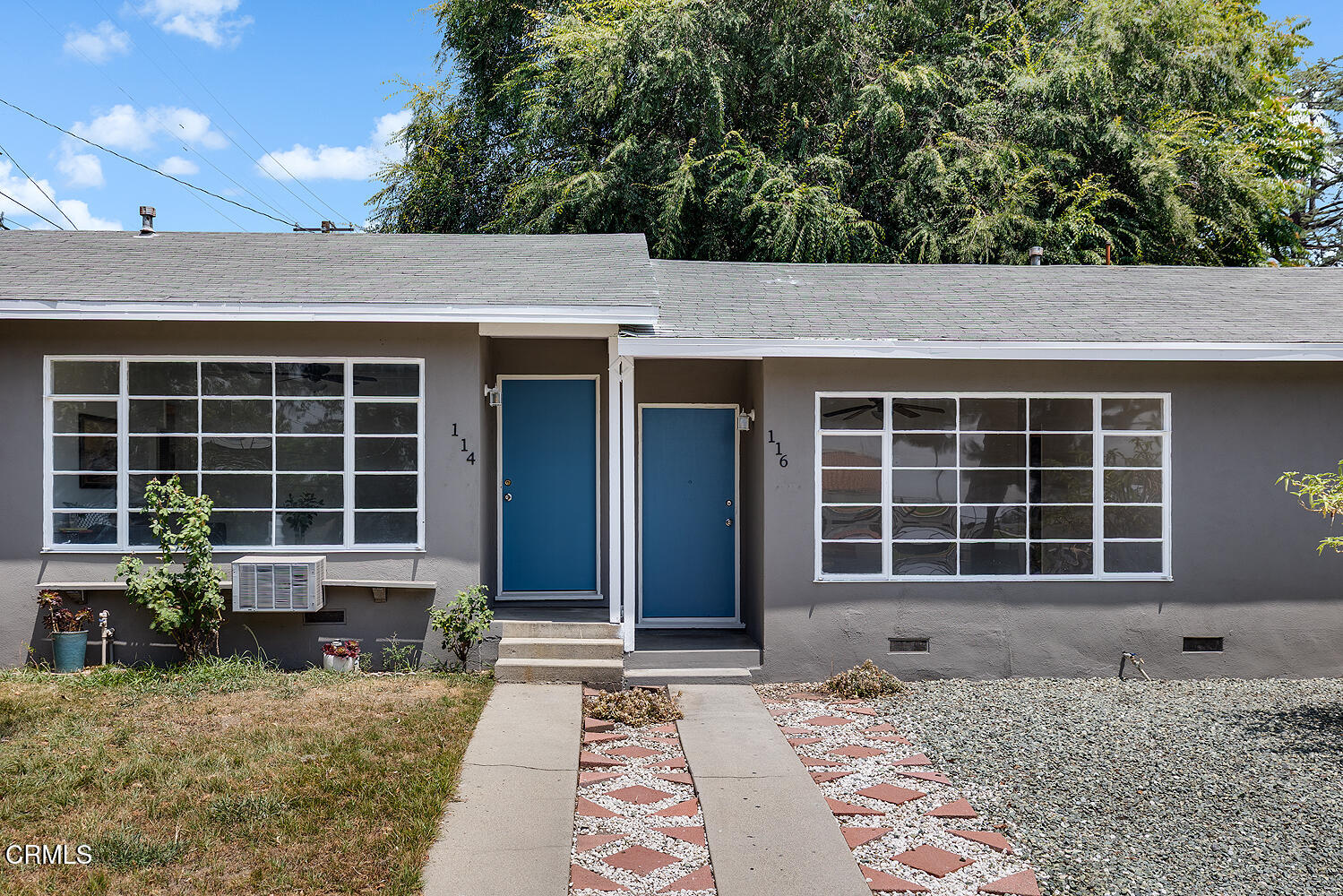 114 South Canyon Boulevard Monrovia, CA 91016 - Photo 3 of 32 a front view of a house with a garden
