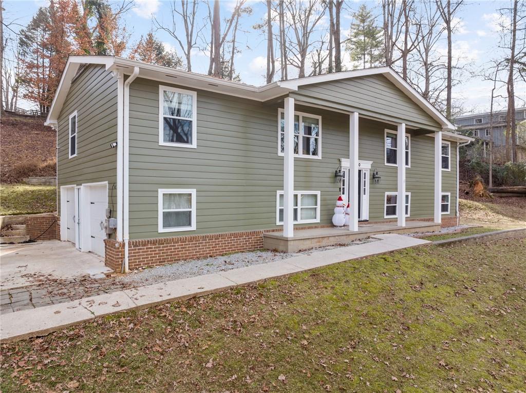 2510 Cove Road Gainesville, GA 30506 - Photo 1 of 1 a front view of a house with a yard and garage